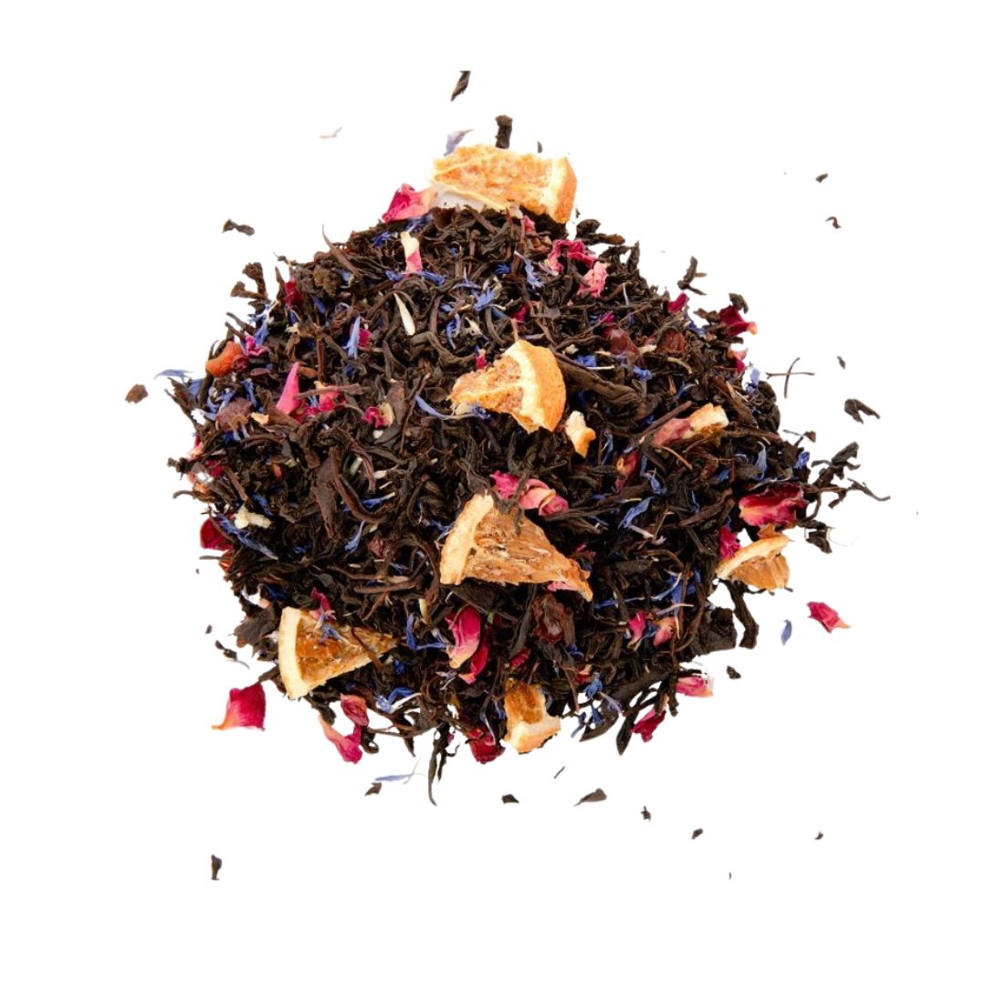 A close-up image of loose leaf tea with a mix of black tea, blue cornflowers, orange peel, rose petals, and rosehip shells.