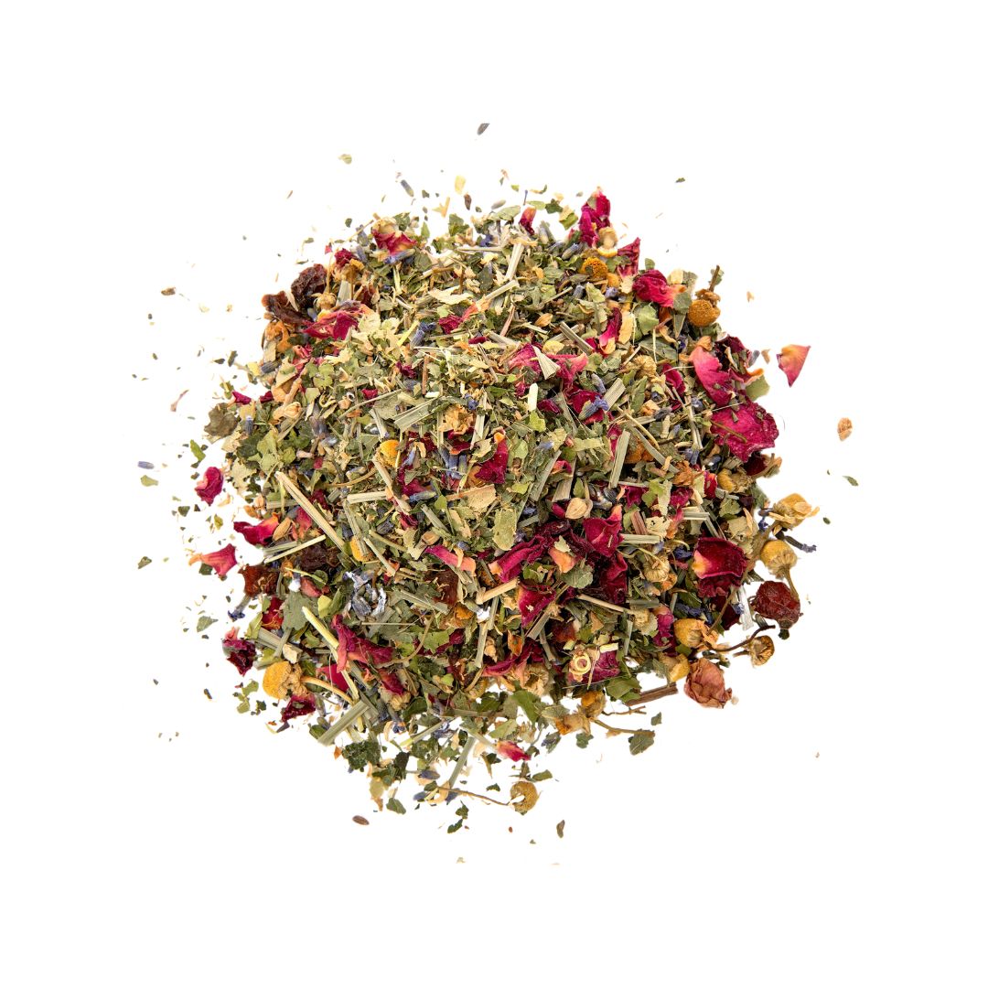 A top-down image of loose leaf herbal tea, with various herbs visible, predominantly in shades of red, orange, and purple.